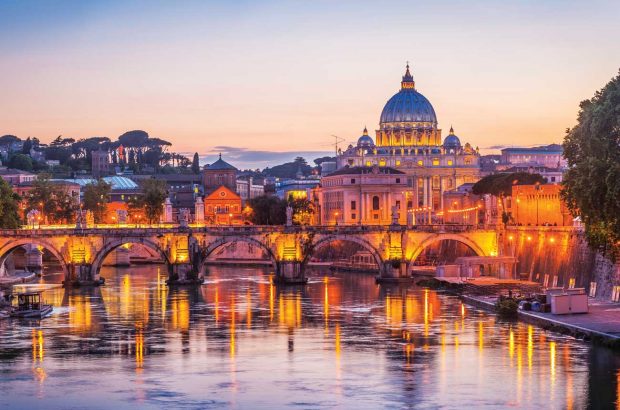 Rome’s Ponte Sant’Angelo Roman bridge with St Peter’s Basilica, Vatican City, beyond